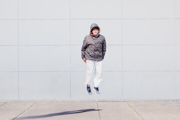 Hoodie male dancer performing break dance