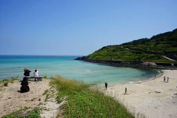 clear bluish beach and people