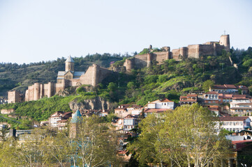 Fototapeta premium An ancient fortress located on a mountain in Tbilisi. An example of historical architecture. 