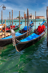 Fototapeta na wymiar Gondolas and St. George Monastery in the background, Venice, Italy