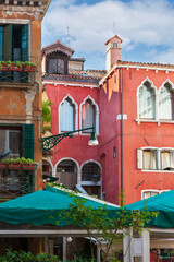 Fototapeta na wymiar Facades of old Venice houses. Venice is a popular tourist destination of Europe. Venice, Italy