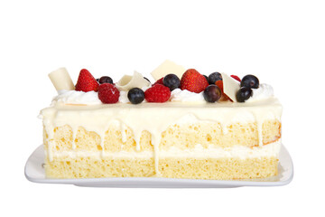 Close up of one vanilla cake bar with white chocolate topped with fresh strawberries, raspberries...