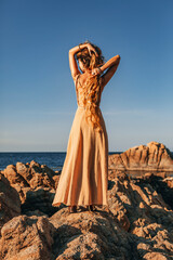 Beautiful young stylish woman on the beach - 503384642