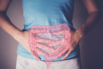 woman hands on her stomach with intesline, probiotics food for gut health, colon cancer, bowel...
