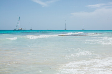 Beautiful marine landscape with coats and sails on the calm torquise Caribbean Sea. 