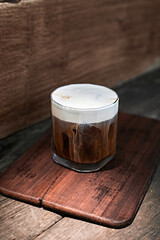 Iced Americano with milk foam