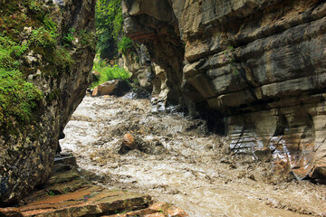 Muddy river in the canyon.