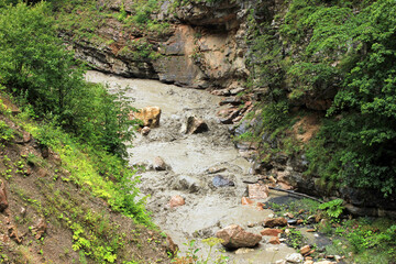 Muddy river in the canyon.