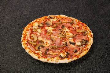 Pizza with ham, cheese and mushrooms