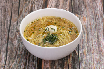 Chicken soup with egg and noodles