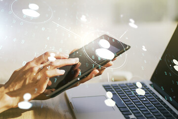 Double exposure of social network icons concept and hand working with a digital tablet on...