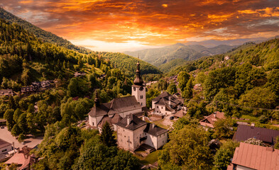 Fototapeta na wymiar Church in The Spania Dolina village with mining landscape, Slovakia, Europe.