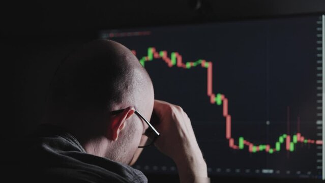 A trader in depression due to a fall in the stock market or crypto currency. Stock market risks.