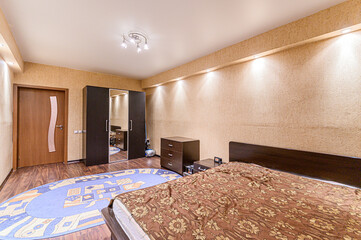 Fototapeta premium Russia, Moscow- May 21, 2020: interior apartment room bedroom with bed