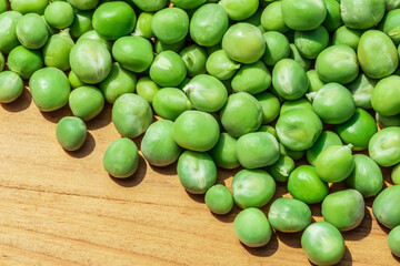 Close up view of fresh raw peas. Healthy organic green raw peas.
