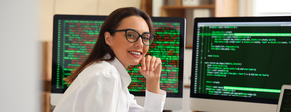 Young female programmer working in office