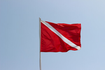 Red with white stripe flag used by lifeguards