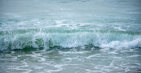 Ocean or sea tropical waves. Ocean background, seascape. Tropical beach with wave, nature background. Copy space of summer vacation and travel concept.