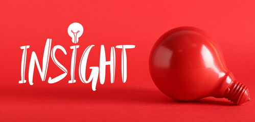 Light bulb and word INSIGHT on red background