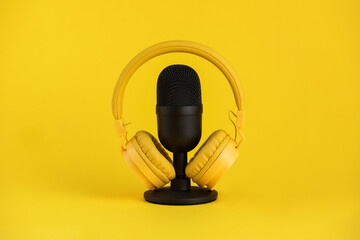 Microphone and headphones on yellow background - obrazy, fototapety, plakaty