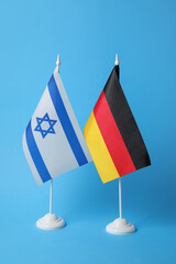 Flags of Germany and Israel on blue background