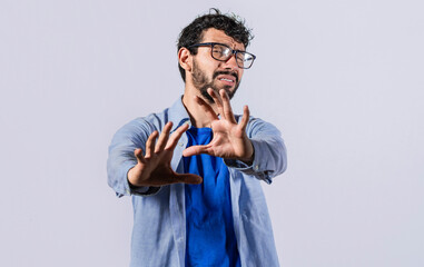a man with rejection expression, man with scared expression on his face making frightened gesture...