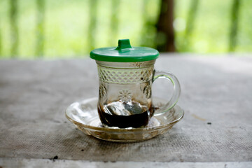 empty cup of coffee with saucer on table