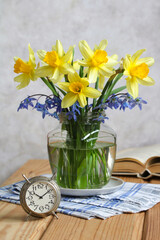 spring still life with daffodils in rustic style.