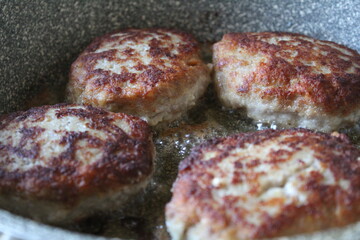 pork cutlets are fried in the kitchen