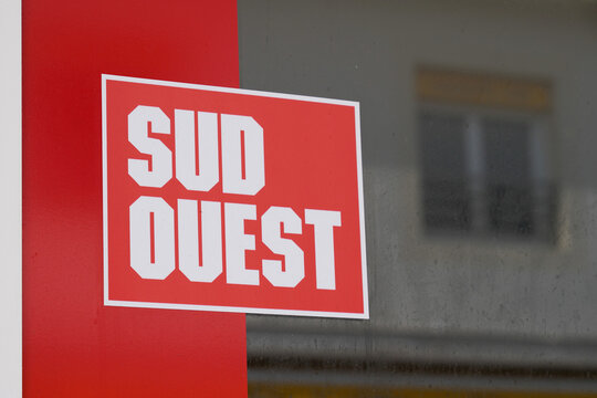 sud ouest newspaper shop sign text and brand logo on windows french library store