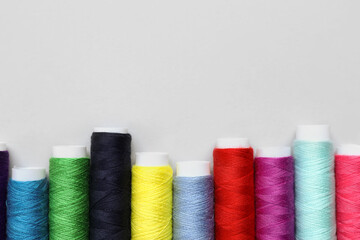 Sewing threads on light background