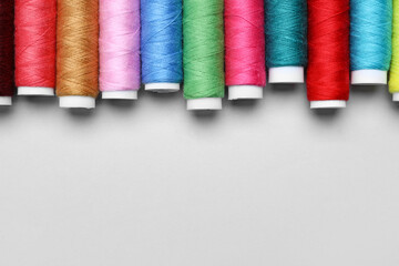 Sewing threads on light background