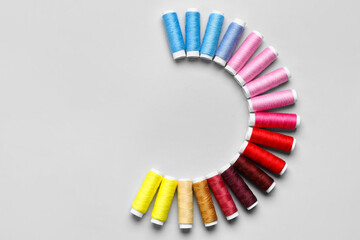 Sewing threads on light background