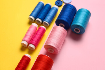 Different thread spools on color background
