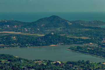 Obraz premium panoramic background of high mountain scenery, overlooking the atmosphere of the sea, trees and wind blowing in a cool blur, spontaneous beauty
