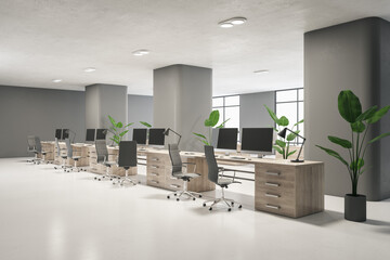 Modern wooden and concrete coworking office interior with empty computer screens, furniture, decorative plants and windows. Workplace and nobody concept. 3D Rendering.