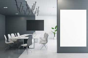 Contemporary designer meeting room interior with furniture, empty mock up presentation frame and daylight. 3D Rendering.