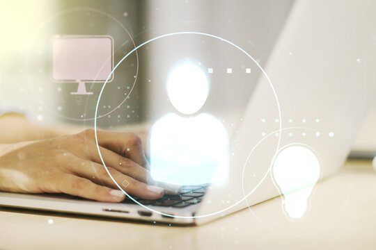 Double exposure of social network icons concept with hand typing on computer keyboard on background. Networking concept