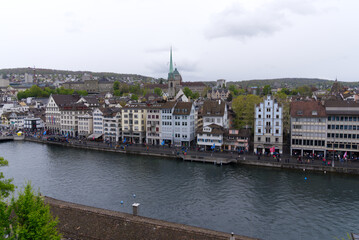 Children's parade of famous spring festival at Limmat Quay with guest Canton Uri at City of Zürich on a rainy spring day. Photo taken April 24th, 2022, Zurich, Switzerland.