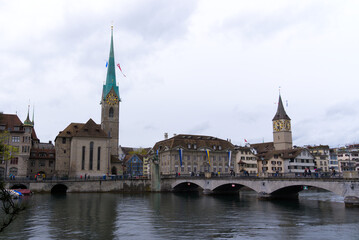 Medieval old town of City of Zürich with protestant churches named Women's Minster and Great Minster on a rainy spring day. Photo taken April 24th, 2022, Zurich, Switzerland.