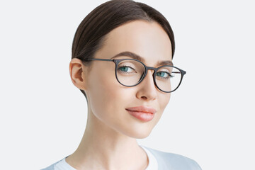 Young beautiful woman isolated portrait, Student girl wearing glasses closeup studio shot, Young...