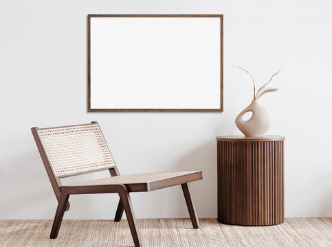 Blank picture frame mockup on white wall. White living room design. View of modern scandinavian style interior with artwork mock up on wall. Home staging and minimalism concept