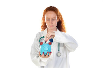 Cute redhead doctor in lab coat saving money