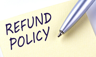 Sticky Note Message REFUND POLICY with pen on white background