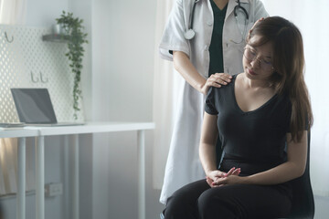 Female physiotherapist examining, treating injured neck of patient in clinic. Physiotherapy rehab, injury recovery and healthcare concept.