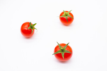 Cherry on a white background. Vegetables for salad