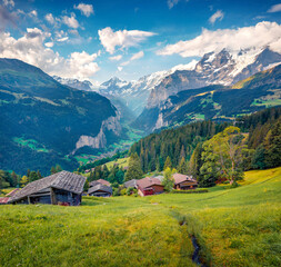 Dramatic eveninfg view of Wengen village. Spectacular summer scene of Swiss Alps, Bernese Oberland in the canton of Bern, Switzerland, Europe. Traveling concept background.