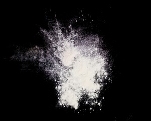 Powder explosion isolated on Dark background. dust particles splash. Powder Explosion dust explodes...