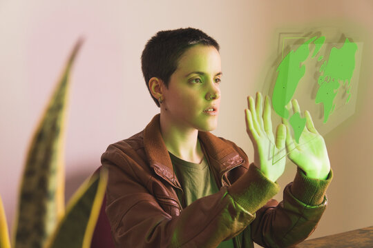 Freelancer woman analyzing map hologram design in office