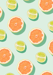 Creative summer pattern made of lime and grapefruit on a mint green background. Minimal flat lay concept. Summer fruits and citrus inspiration.
